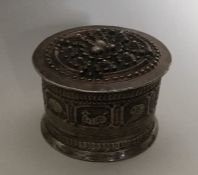 A large cylindrical Islamic silver box decorated w