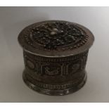 A large cylindrical Islamic silver box decorated w