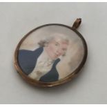 An oval gold miniature depicting a gentleman of ti