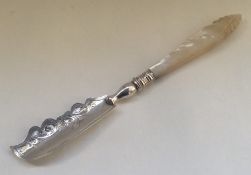 An Edwardian silver engraved butter knife with MOP