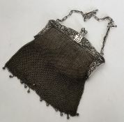 A good Chinese silver mesh purse decorated with fl