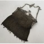 A good Chinese silver mesh purse decorated with fl