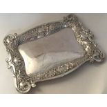 A heavy decorated silver dressing table tray. Birm