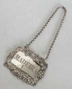 A Victorian chased silver wine label for 'Madeira'