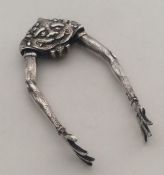 A rare pair of Victorian silver sugar tongs in the