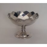 A circular silver panelled pedestal sweet dish. Bi