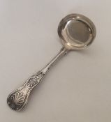 A Kings' pattern plain silver cream ladle. London.