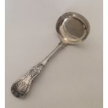 A Kings' pattern plain silver cream ladle. London.