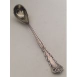 An American silver gilt preserve spoon with scroll