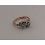 An 18 carat heart shaped diamond three stone ring.