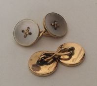 A pair of high carat gold and MOP cufflinks. Appro