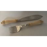 A pair of ivory and silver engraved fish servers w