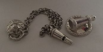 An unusual silver whistle on circular mount of tap
