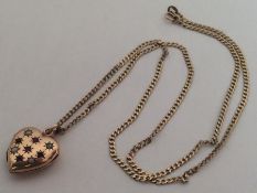 A ruby and pearl locket on fine link chain. Approx