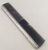 LIBERTY & CO: A tortoiseshell mounted comb with te