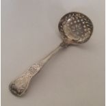 A Kings' pattern silver sifter spoon. London. By S