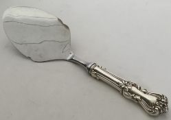 A Continental silver cake slice with steel blade.