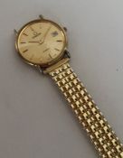 A gent's 18 carat gold Swiss made wristwatch on ex