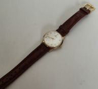 A gent's 9 carat Tissot wristwatch with silvered d