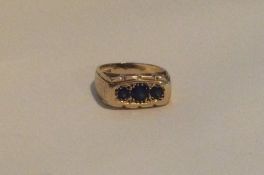A heavy 9 carat blue stone ring of rectangular for