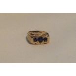 A heavy 9 carat blue stone ring of rectangular for