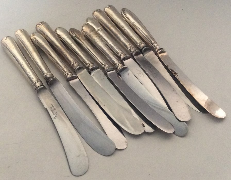 A group of silver mounted tea knives with steel bl