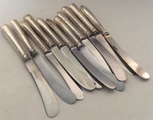 A group of silver mounted tea knives with steel bl