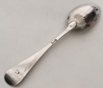 A mint condition Georgian silver shell back spoon.