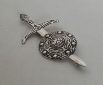 A Celtic silver sword and shield brooch. Approx. 2