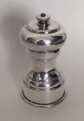 A silver plated pepper grinder. Est. £10 - £20.