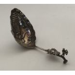 A small Dutch silver preserve spoon decorated with