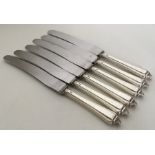 A good heavy set of six silver handled tea knives.