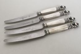 GEORG JENSEN: A set of four silver mounted knives