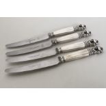 GEORG JENSEN: A set of four silver mounted knives
