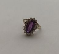 A 9 carat amethyst and white sapphire cluster ring