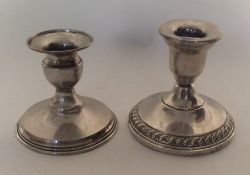 Two silver piano candlesticks of circular form. Ap