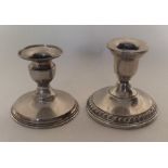 Two silver piano candlesticks of circular form. Ap