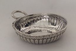 An 18th Century French silver wine taster. Maker's