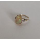 A 9 carat opal single stone ring. Approx. 3 grams.