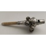 A good quality silver rattle decorated with wriggl