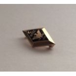 An unusual miniature Russian gold brooch. Approx.