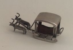 A novelty miniature silver table toy. Approx. 7.5