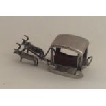 A novelty miniature silver table toy. Approx. 7.5