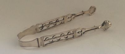 A pair of unusual Georgian silver cast sugar tongs