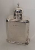 A Queen Anne style silver tea caddy with lift-off