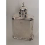 A Queen Anne style silver tea caddy with lift-off