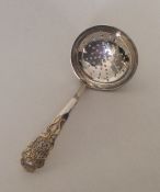 A good quality silver and silver gilt sifter spoon