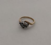 A sapphire mounted four row crossover ring in 9 ca