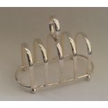 A five bar silver toast rack / smartphone docking