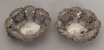 A pair of small silver bonbon dishes decorated wit